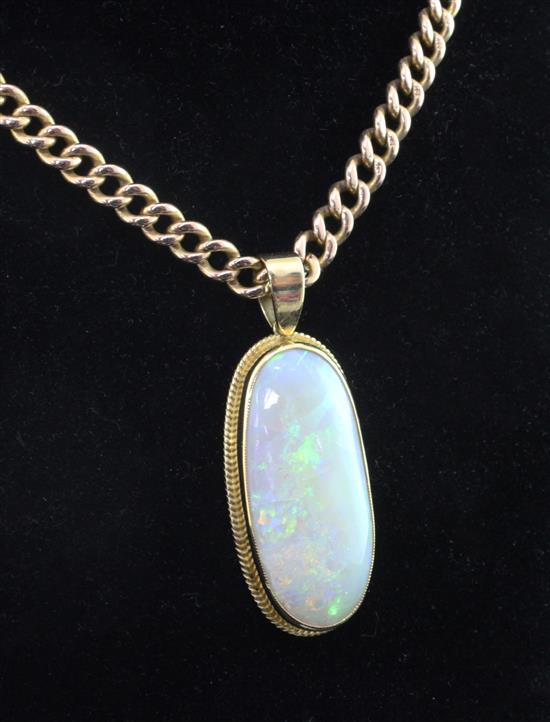 An 18ct gold and white opal oval pendant together with a 15ct gold albert chain, gross weight 50 grams.